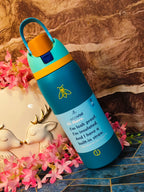 Blue water bottle with yellow cap on a decorative surface with flowers and a deer figurine.