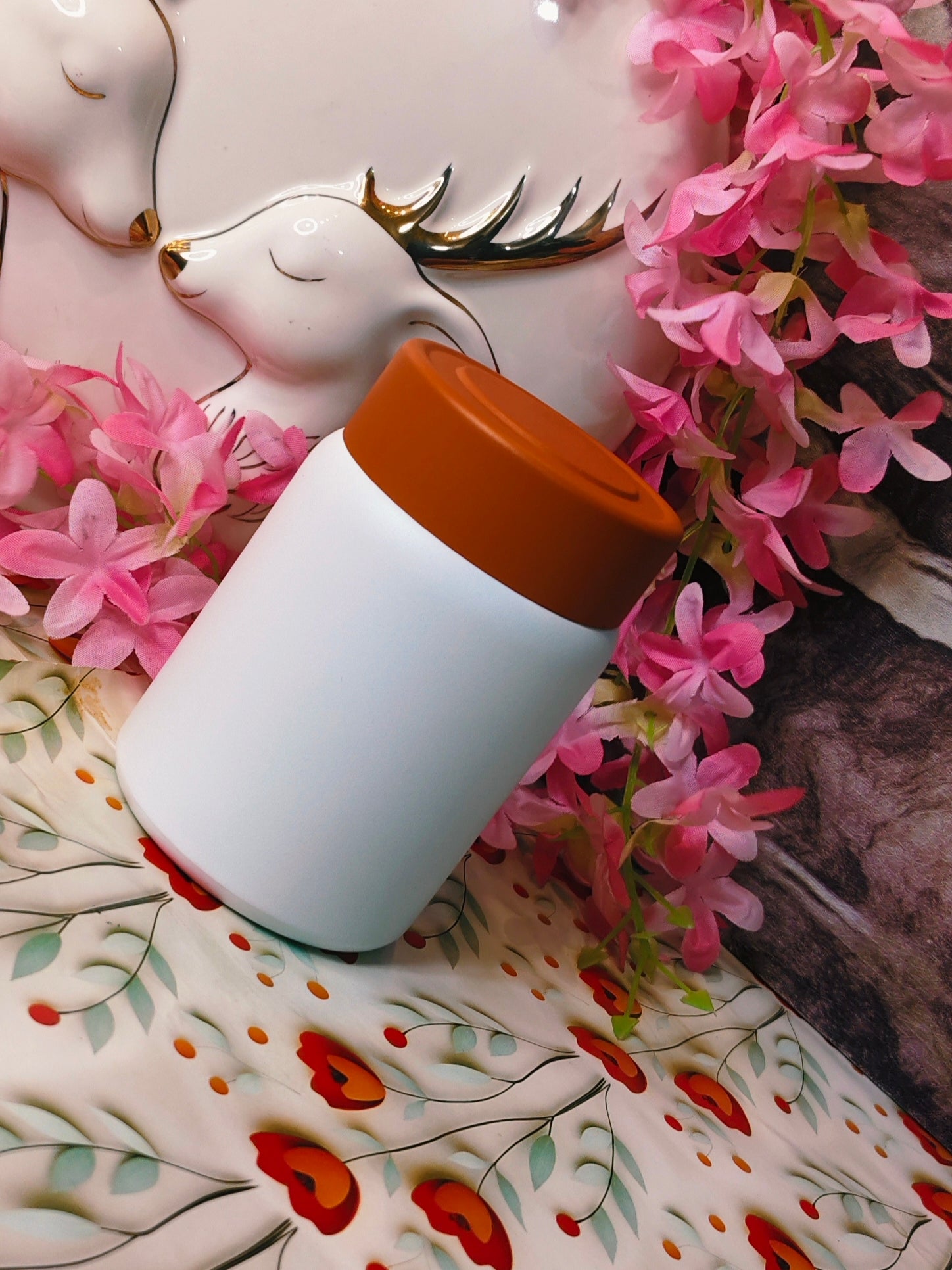 white steel food box in 180ml with a brown steel cap on top