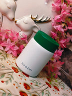 White food jar with green cap labeled 'GUOZHI'in stainless steel