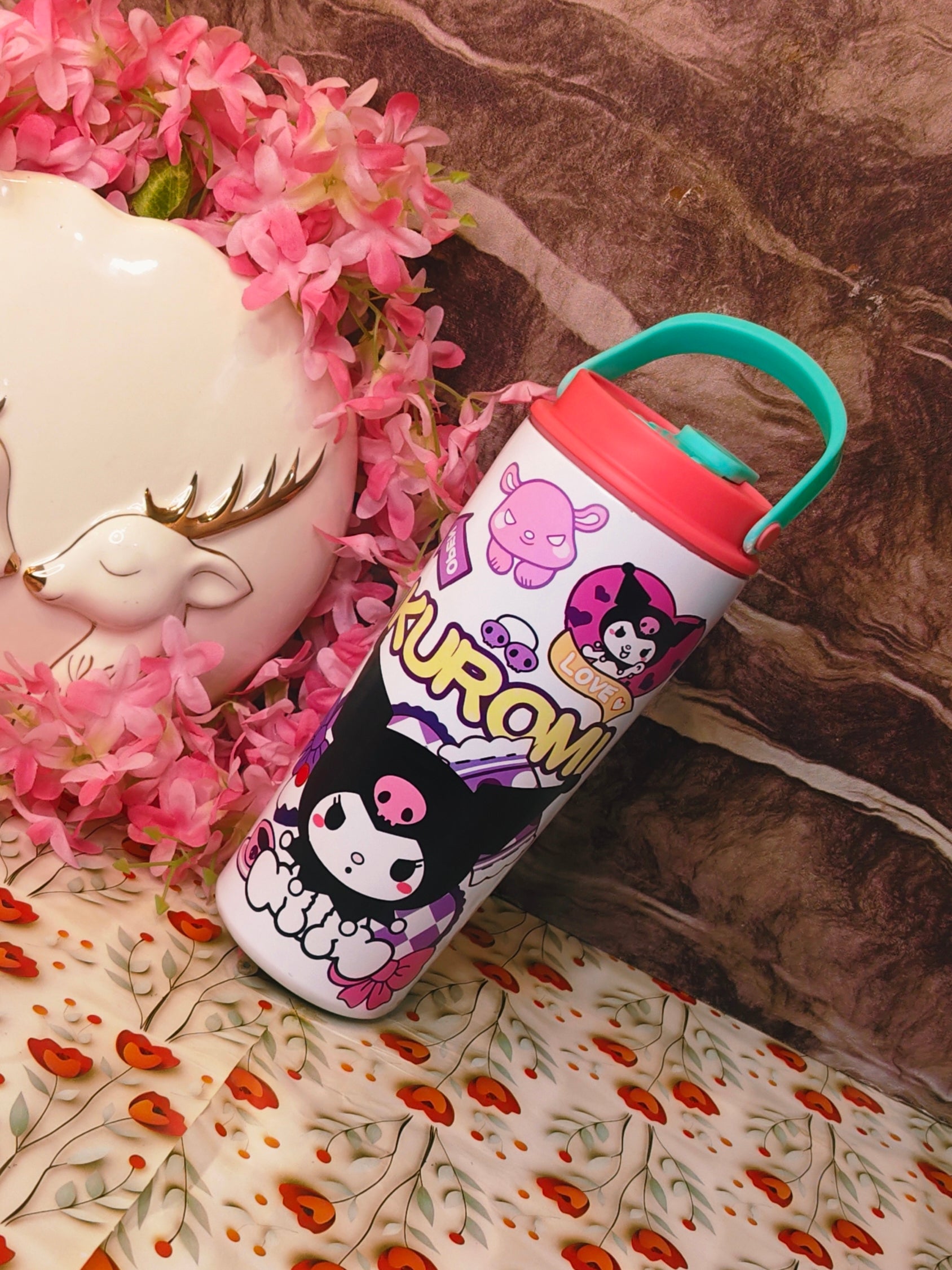 Kuromi-themed water bottle with pink flowers and decorative background
