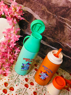 Two children's water bottles with cartoon characters on a floral surface.